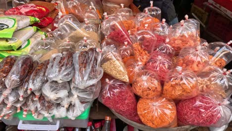 various dried foods displayed at a market stall