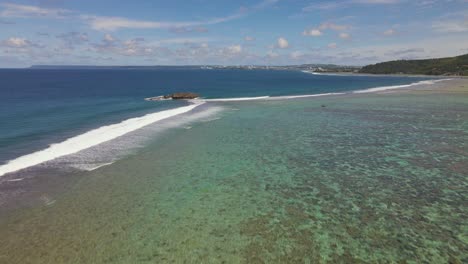 Drone-shot-rising-up-over-the-waters-of-the-tropical-island-Guam