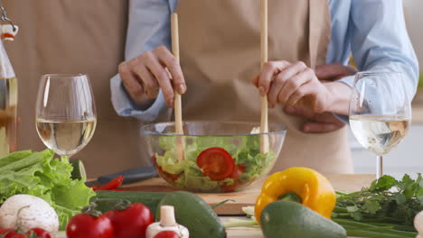 couple cooking a salad