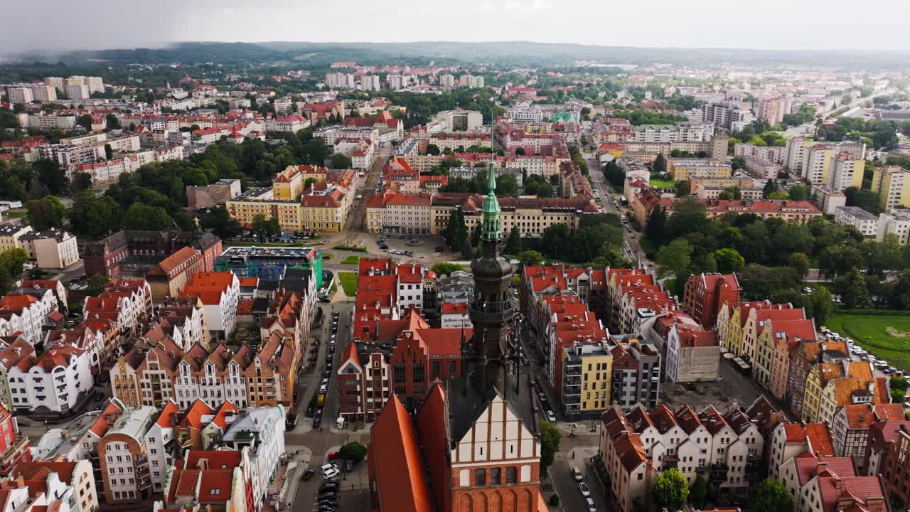Drone of historic cathedral and red rooftops in Elbląg Poland showing old Europe