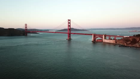 aerial rising shot toward the golden gate bridge, sunrise in san francisco, usa