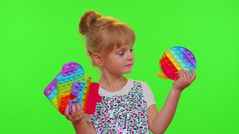 Children-girl-kid-holding-squeezing-anti-stress-touch-screen-push-pop-it-popular-toy-on-chroma-key