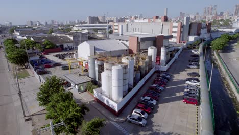 the bustling industrial scene of a factory in barranquilla comes to life, showcasing the heart of manufacturing and production in the city