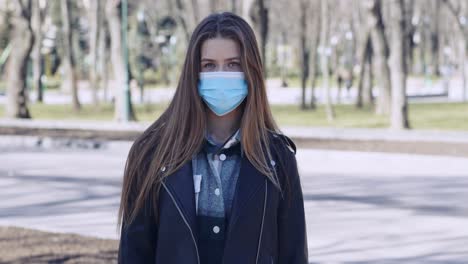 woman wearing a face mask in a park