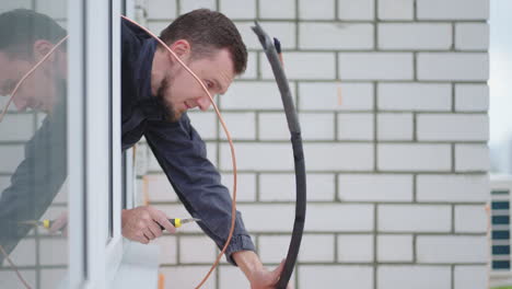 installation and installation of the air cooling system in the apartment. a man at high altitude installs air conditioning. replacement of thermal insulation. air conditioning systems