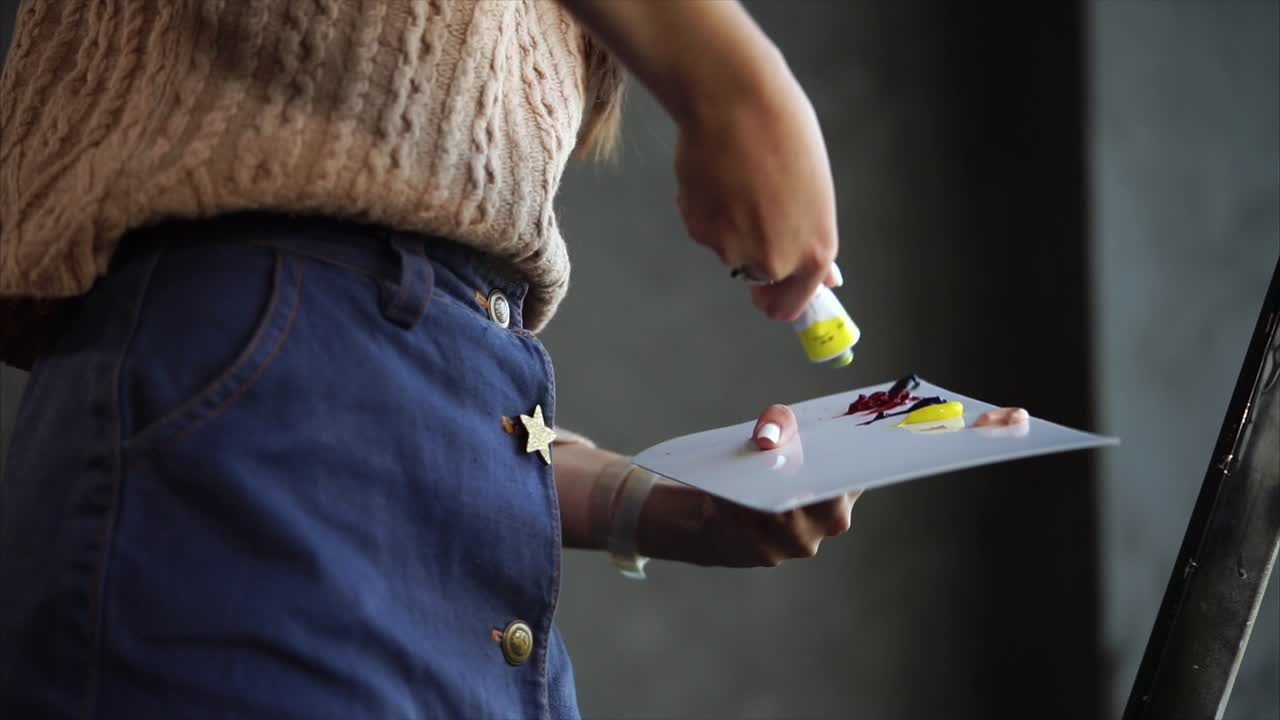 Woman Mixing Acrylic Paints on a Palette