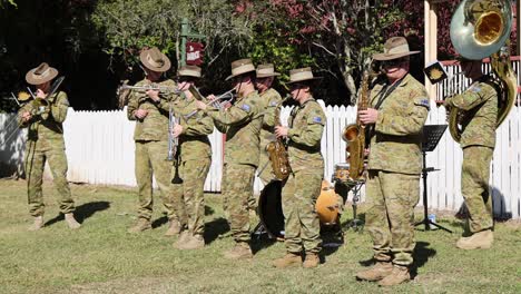 soldiers in uniform playing various musical instruments