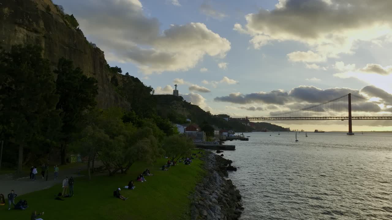 Static drone shot of river side in Almada, Portugal