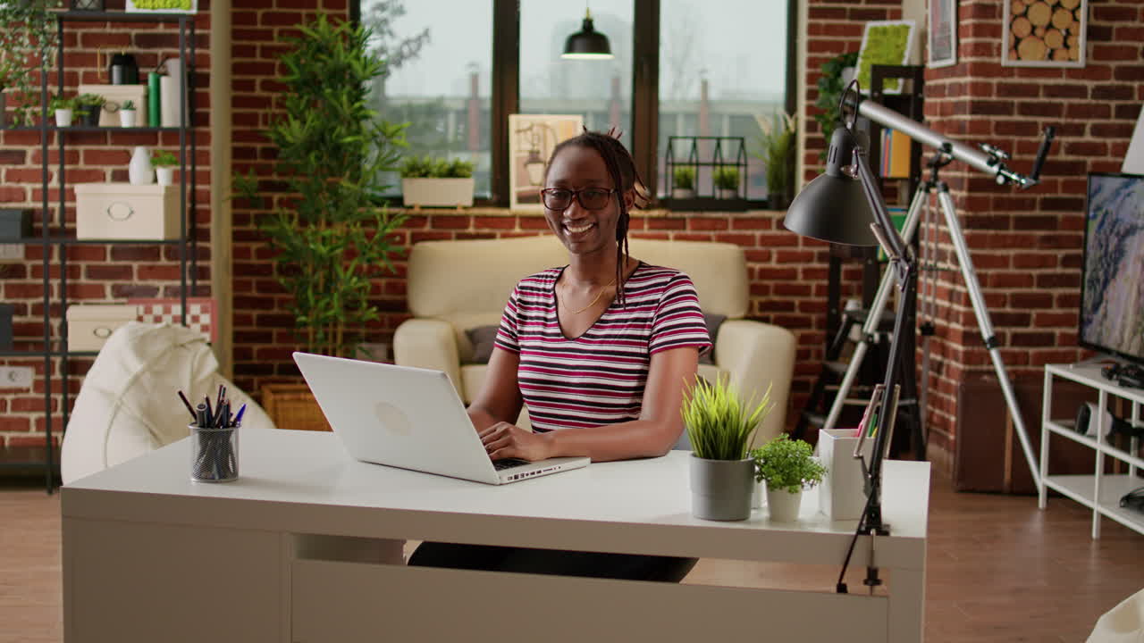 Woman Working on Laptop at Home
