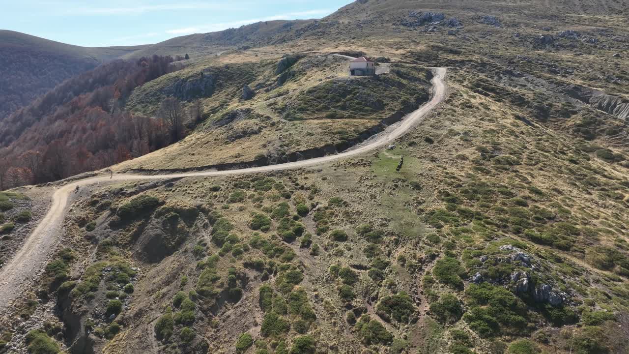 Winding dirt roads, rocky hills, and scattered vegetation on the rugged slopes of Mount Vermio. Greece