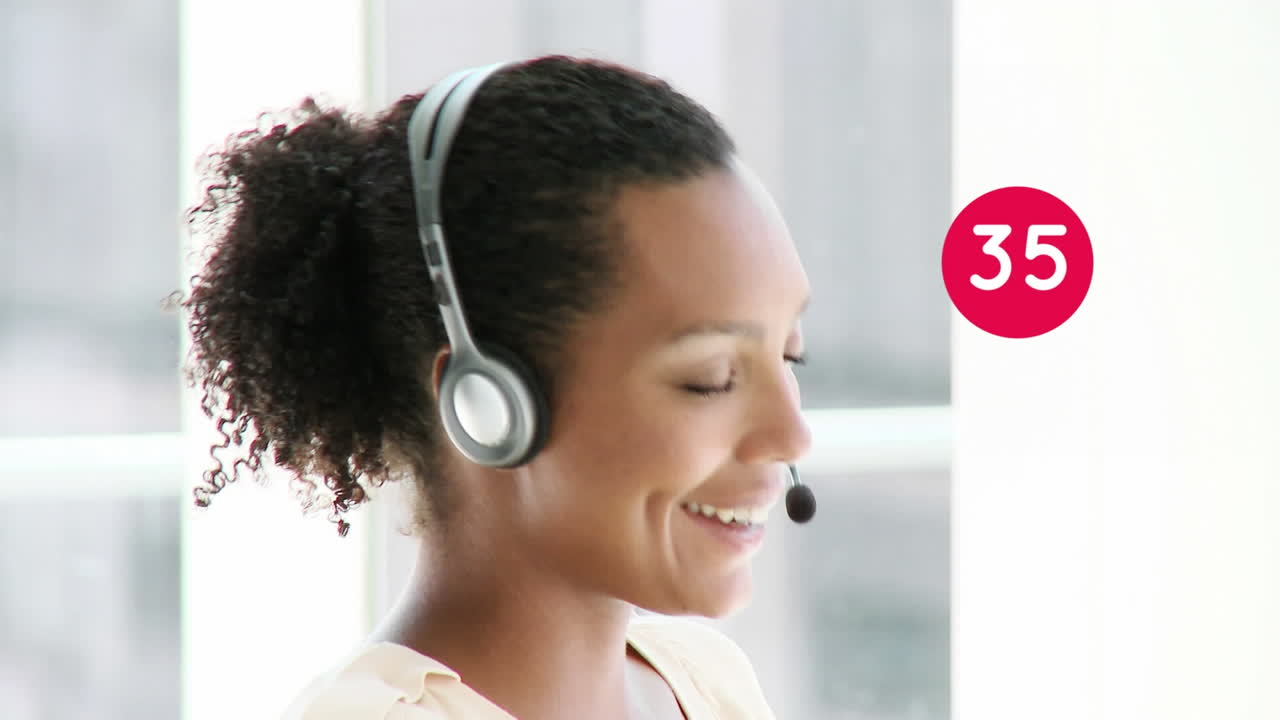 Animation of numbers changing over businesswoman using phone headset