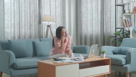 stressed woman dealing with finances at home