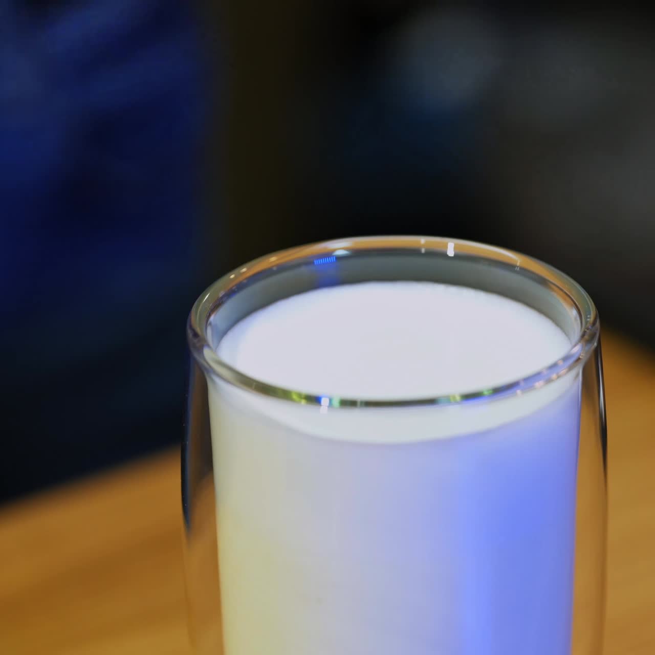 Barista brewing coffee by modern machine