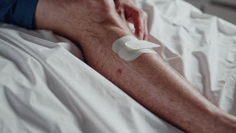 injured leg with adhesive bandages