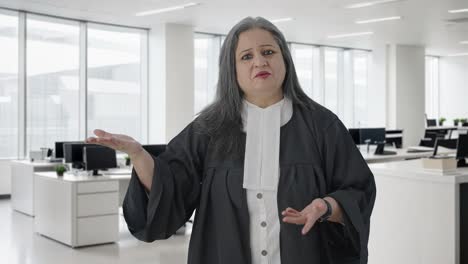 angry indian senior female lawyer fighting the case in court