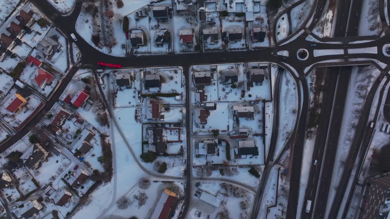 Tonsengagen Bjerke Arvoll Oslo Norge Norway aerial drone morning neighborhood apartment condominiums buildings cars traffic snowing snow flakes cold cloudy winter day gray skies city forward Birdseye