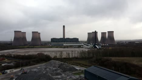 aerial orbiting view across coal fired power station site, fiddlers ferry overcast smokestack skyline