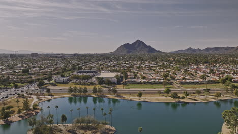 Scottsdale-Arizona-Aerial-v5-drone-flyover-Chaparral-Lake-and-Villa-Monterey-neighborhood-towards-Camelback-mountain-capturing-cityscape-with-desert-views---Shot-with-Mavic-3-Cine---February-2022