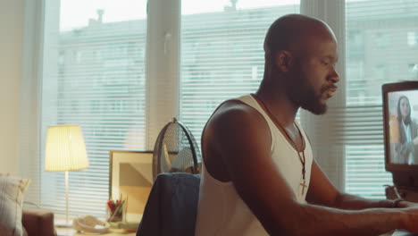 Black-Man-Working-on-Laptop-at-Home