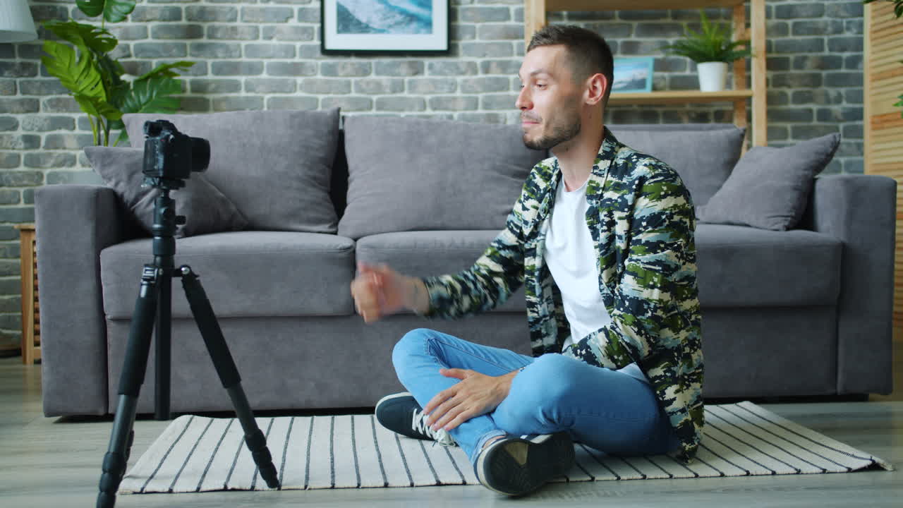 Man Recording a Video Blog at Home