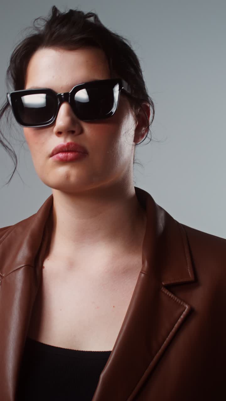 Woman in Sunglasses and Brown Jacket