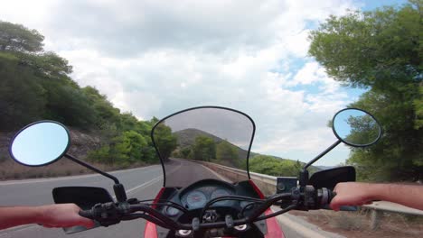 riding a motorcycle on penteli mountain in greece