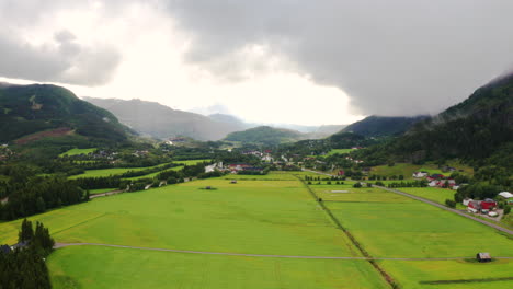 wide aerial view of the open valley fields in rural hemsedal, norway