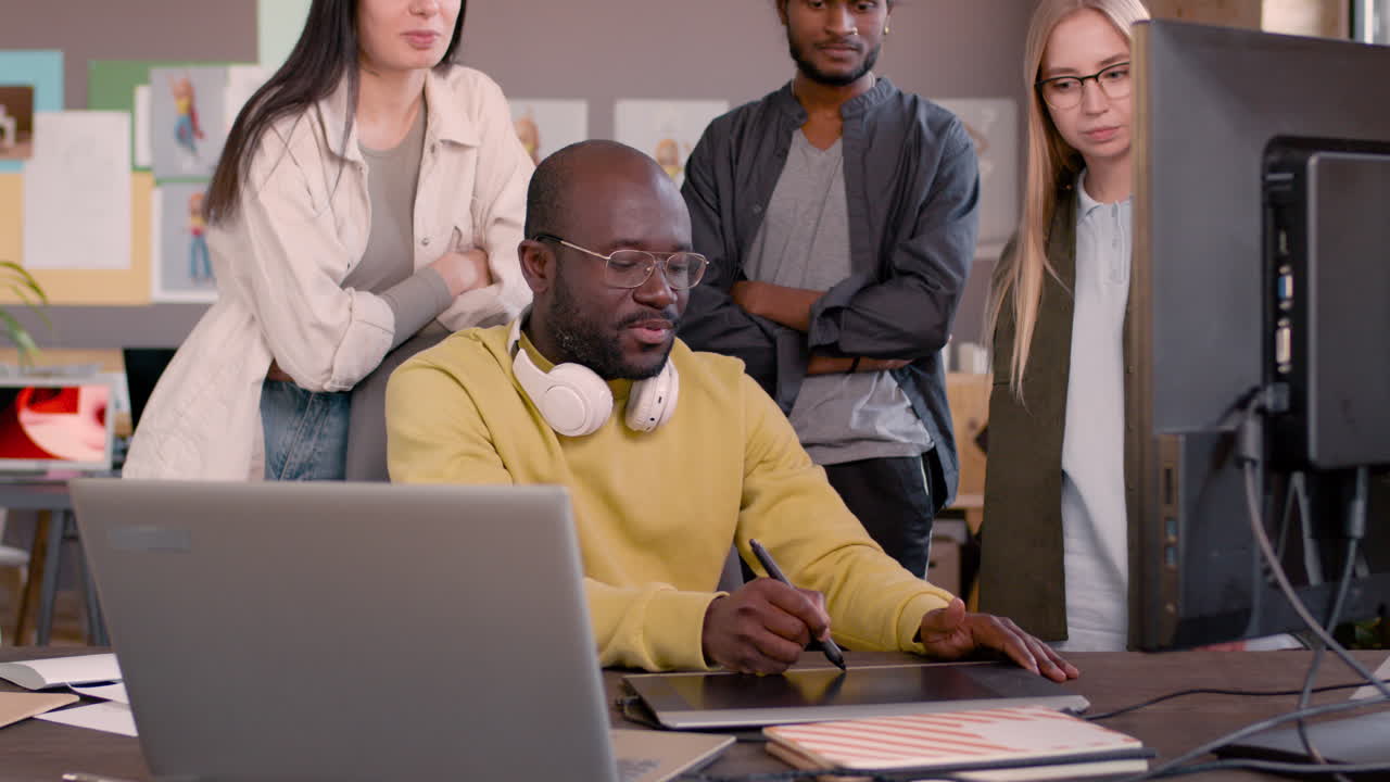 Multiethnic Team Of Graphic Designers Working Together In An Animation Studio 13