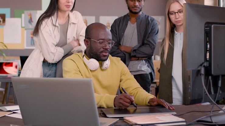 Multiethnic Team Of Graphic Designers Working Together In An Animation Studio 13