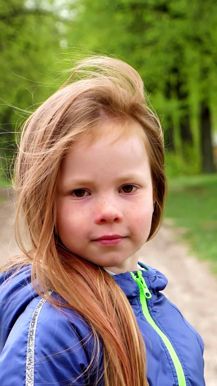 Girl with Long Hair in a Park