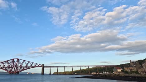 clouds moving over forth bridge in edinburgh