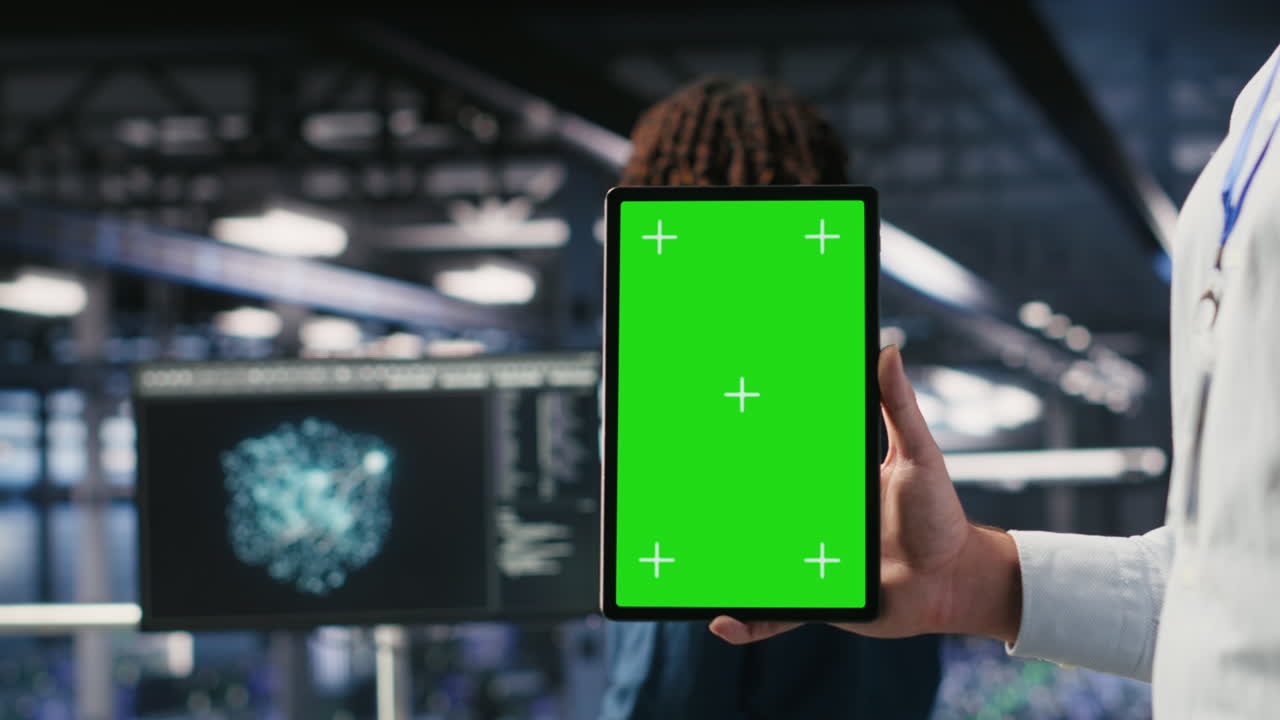 Close up of data center employee doing tasks on isolated screen tablet