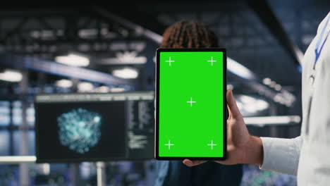 close up of data center employee doing tasks on isolated screen tablet