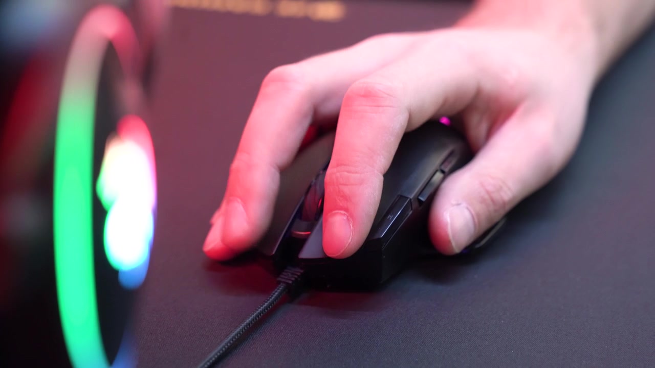 Close-up of Hand Clicking and Scrolling a Gaming Mouse