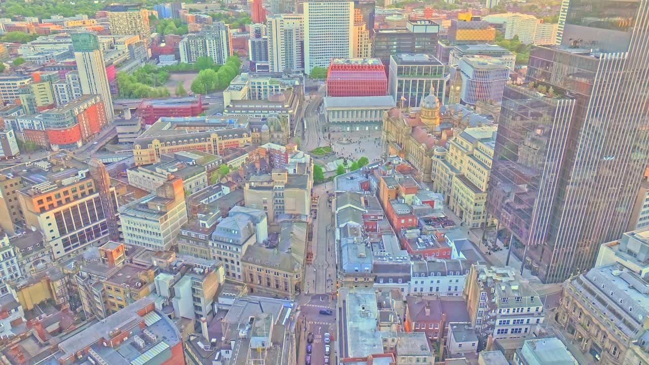 Aerial footage captures a dramatic upward view above Birmingham’s downtown, showcasing a blend of historic architecture, modern skyscrapers, and vibrant city streets