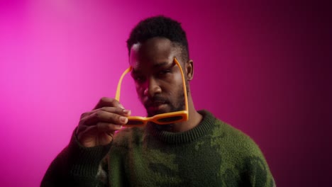 stylish man in pink background