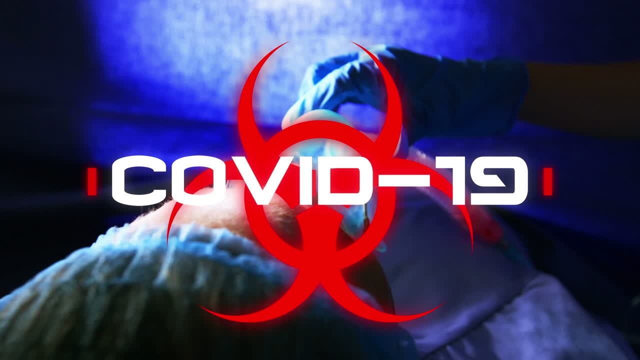 Animation of word Covid19 with healthcare worker in background