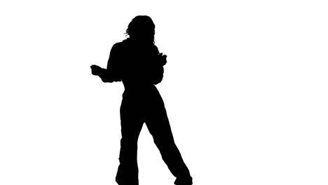 studio silhouette of woman dancing against white background