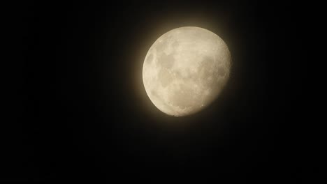 haunted creepy near full moon with eerie dark clouds moving past in the foreground, perfect for halloween, scary dark themed, celestial footage