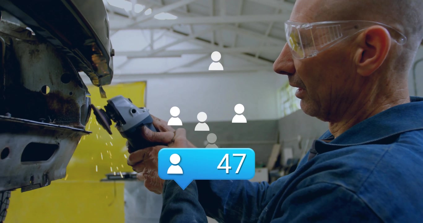 Mechanic using angle grinder smoothing panel at body shop and updating count bubble to ninety five