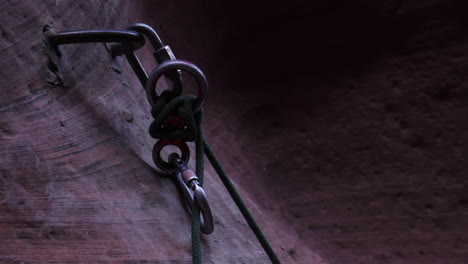 climbing rope moves with carbiner and clip as climber rappells in zion national park