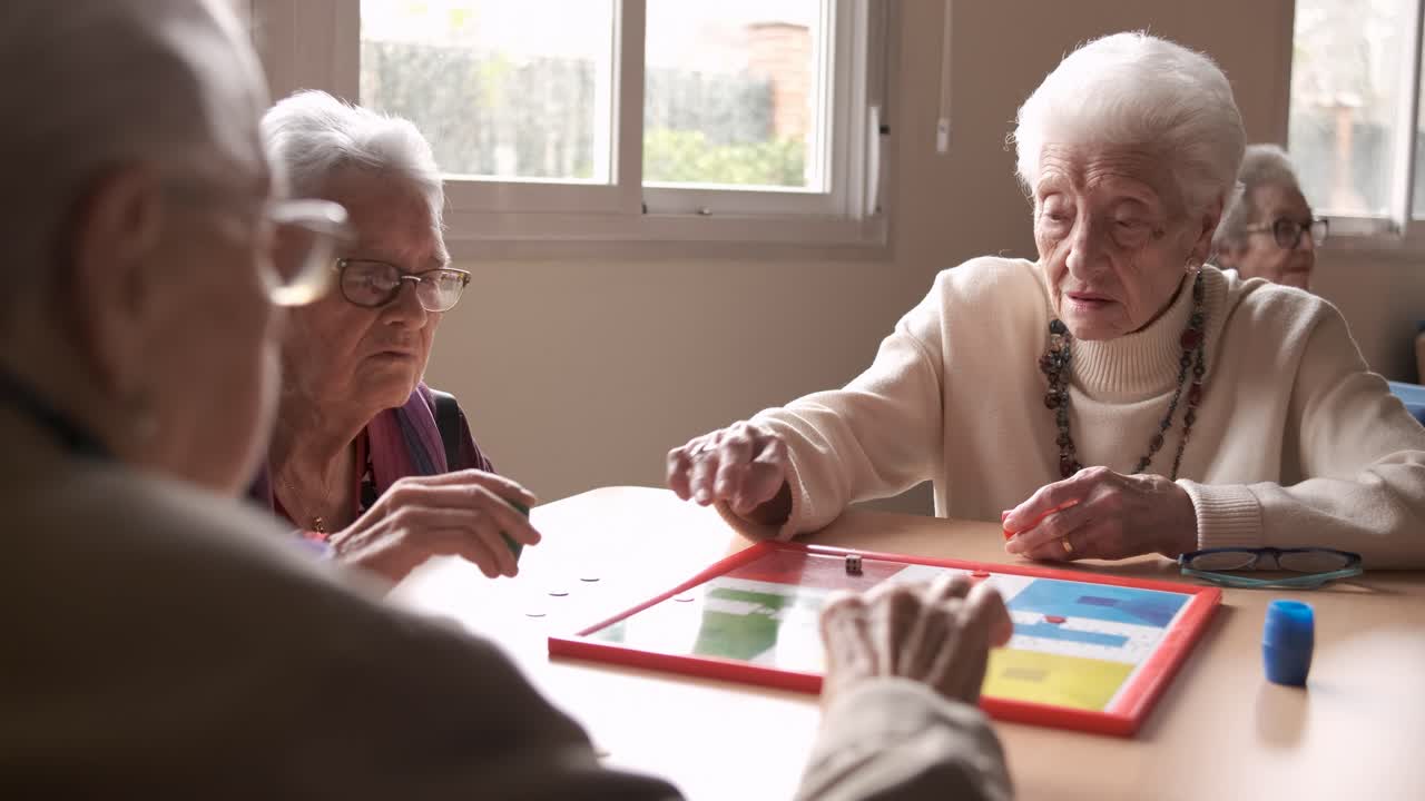 Senior people playing board game in retirement home