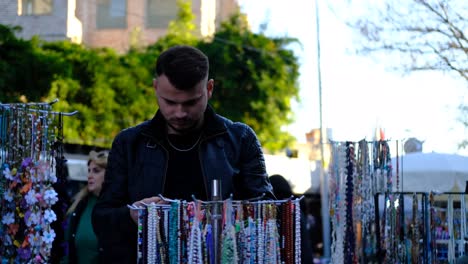 man looking gift stand