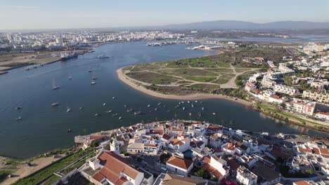 ferragudo town in portugal, establishing aerial view of townscape and marina