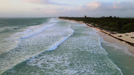 Aerial-view-of-sea-waves-reaching-the-beach-coast