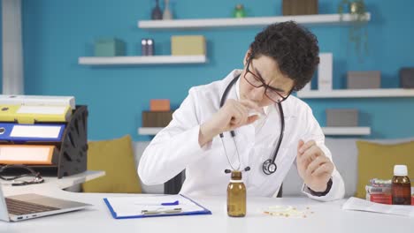 Curious-boy-in-white-doctor-uniform-and-stethoscope-sitting-at-table-at-home,-dreaming-of-becoming-a-doctor.