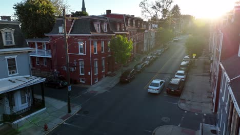 car driving down an urban neighborhood street