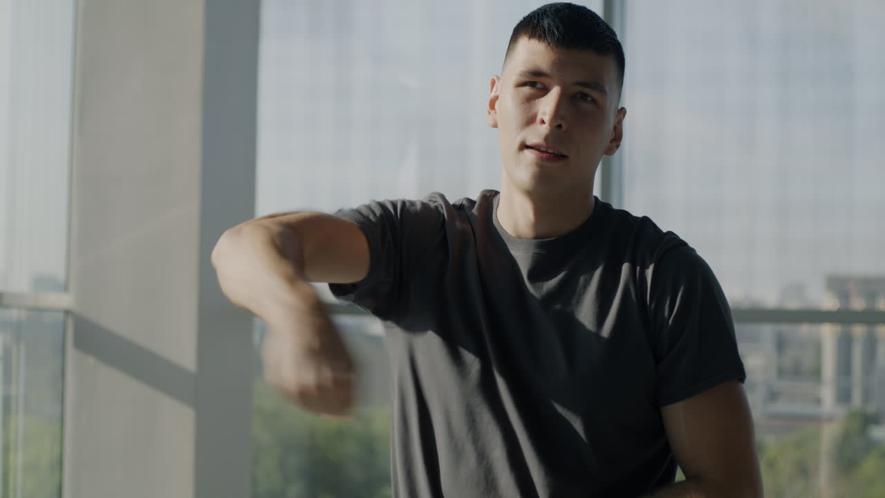 Young Man Doing Arm Exercise