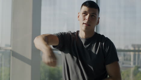 young man doing arm exercise