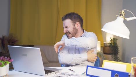 home office worker man itching with allergies.